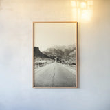 Road to Old West by Nathan Larson. shown as a paper print in a natural frame. Available as a archival giclee rolled canvas, fine art paper, or poster print. SKU 72028h.