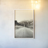 Road to Old West by Nathan Larson. shown as a paper print in a white frame. Available as a archival giclee rolled canvas, fine art paper, or poster print. SKU 72028h.