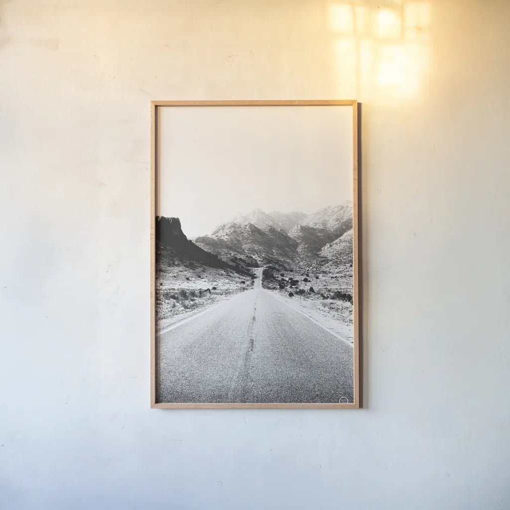 Road to Old West BW by Nathan Larson. shown as a paper print in a natural frame. Available as a archival giclee rolled canvas, fine art paper, or poster print. SKU 72754h.