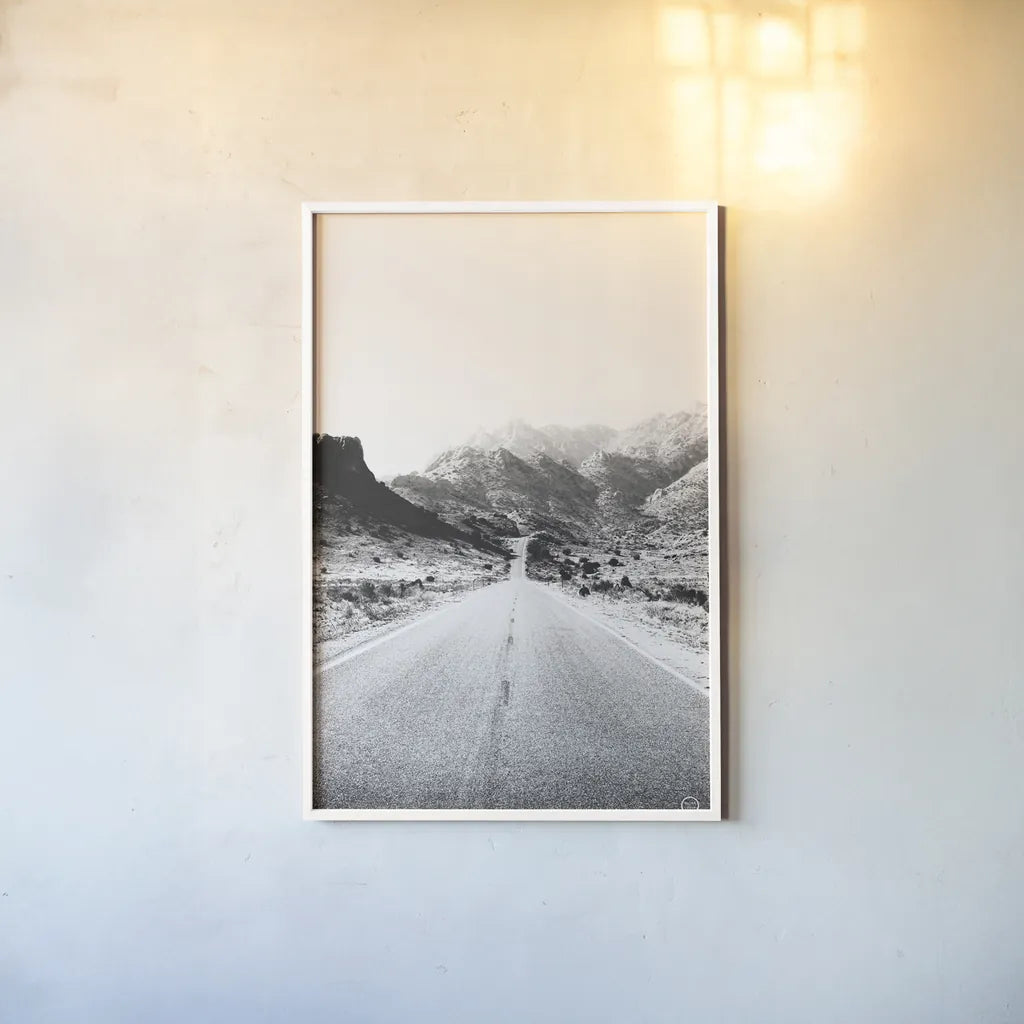 Road to Old West BW by Nathan Larson. shown as a paper print in a white frame. Available as a archival giclee rolled canvas, fine art paper, or poster print. SKU 72754h.