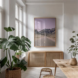Road to Old West Purple by Nathan Larson. shown as a print in a natural wood frame in a dining room. Available as a archival giclee rolled canvas, fine art paper, or poster print. SKU 79243h.