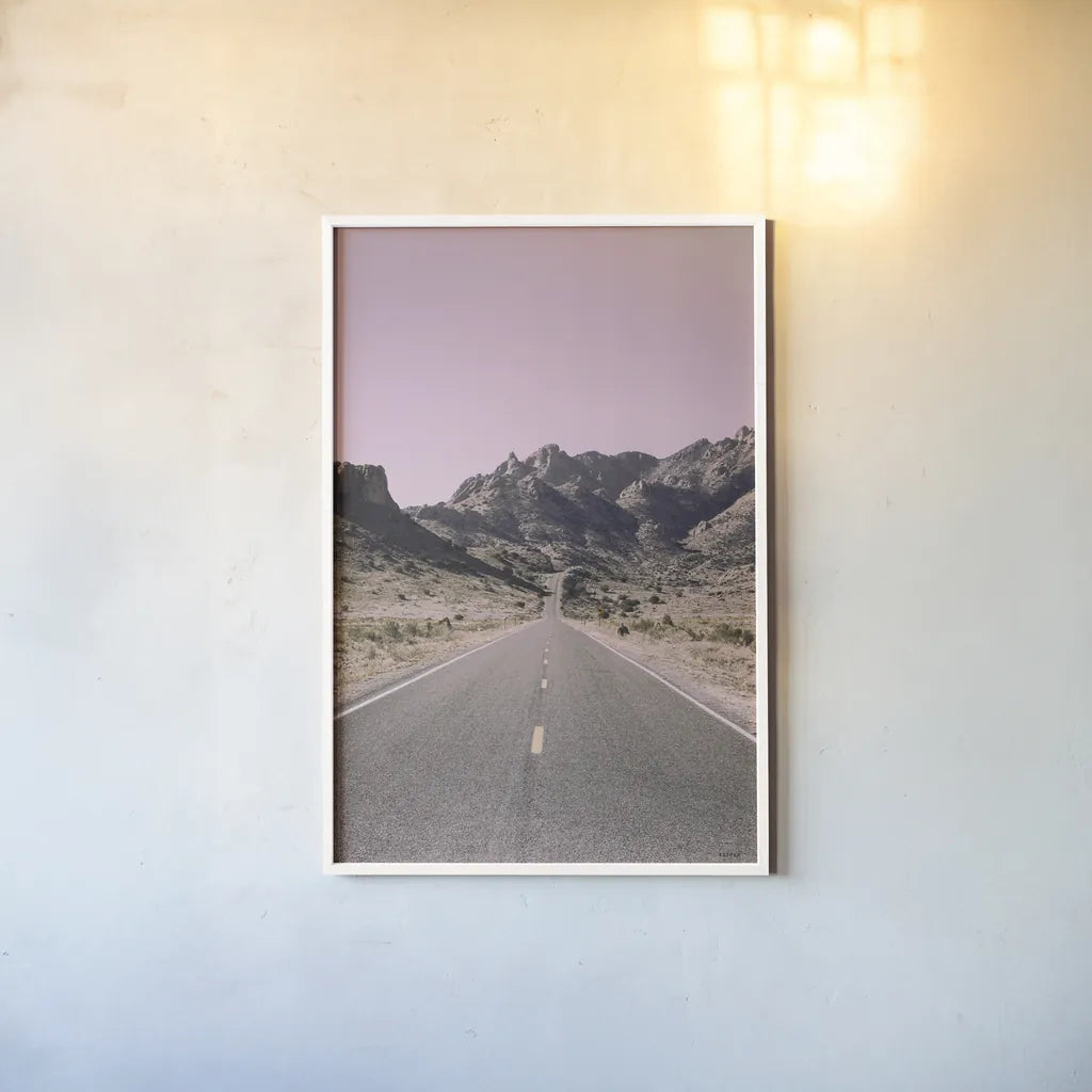 Road to Old West Purple by Nathan Larson. shown as a paper print in a white frame. Available as a archival giclee rolled canvas, fine art paper, or poster print. SKU 79243h.