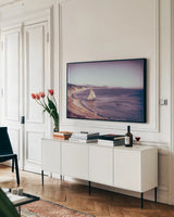 Rock Coast by Nathan Larson. shown as a framed stretched canvas in a living room above a console. Available as a archival giclee rolled canvas, fine art paper, or poster print. SKU 90184i.