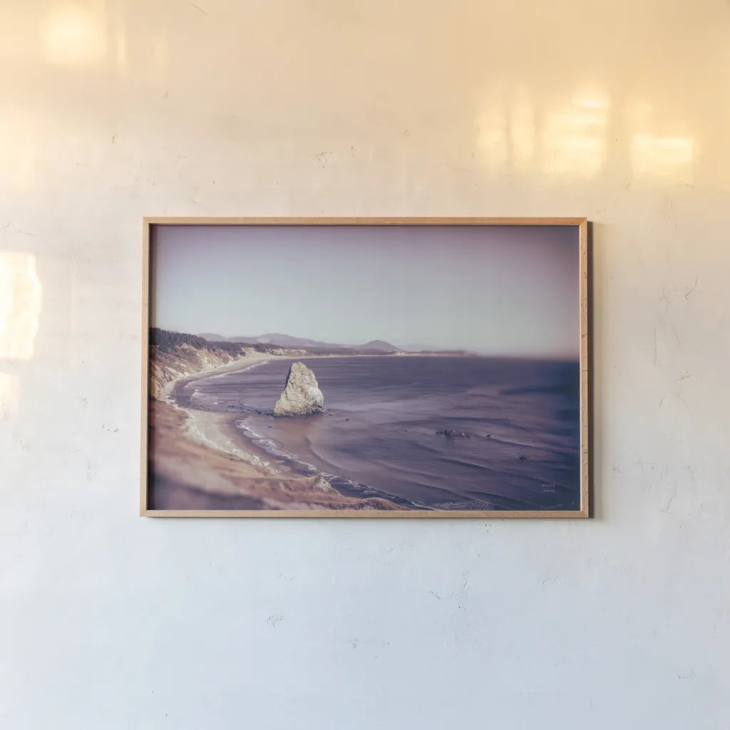 Rock Coast by Nathan Larson. shown as a paper print in a natural frame. Available as a archival giclee rolled canvas, fine art paper, or poster print. SKU 90184i.