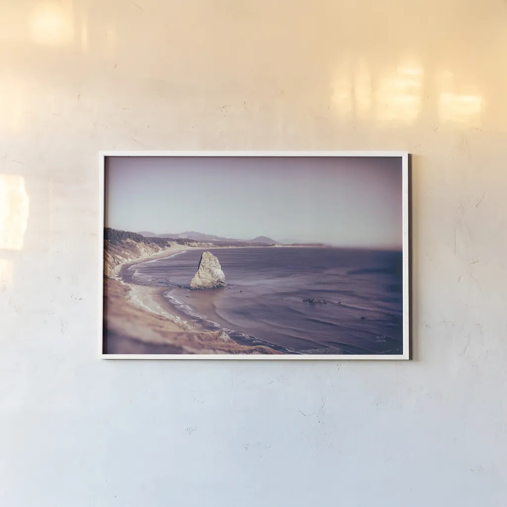 Rock Coast by Nathan Larson. shown as a paper print in a white frame. Available as a archival giclee rolled canvas, fine art paper, or poster print. SKU 90184i.