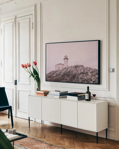 Rocky Lighthouse by Nathan Larson. shown as a framed stretched canvas in a living room above a console. Available as a archival giclee rolled canvas, fine art paper, or poster print. SKU 91851i.