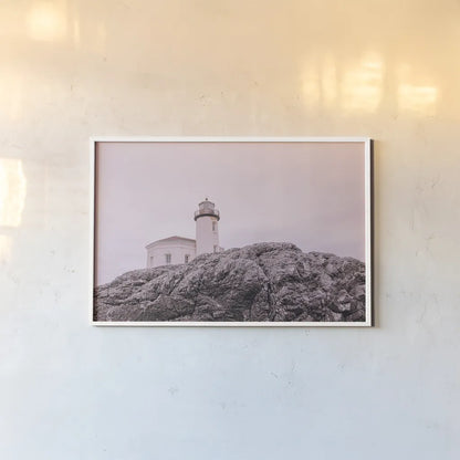 Rocky Lighthouse by Nathan Larson. shown as a paper print in a white frame. Available as a archival giclee rolled canvas, fine art paper, or poster print. SKU 91851i.