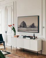 Rocky Shores by Nathan Larson. shown as a framed stretched canvas in a living room above a console. Available as a archival giclee rolled canvas, fine art paper, or poster print. SKU 92598i.