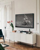 Rodeo I BW by Nathan Larson. shown as a framed stretched canvas in a living room above a console. Available as a archival giclee rolled canvas, fine art paper, or poster print. SKU 82721i.