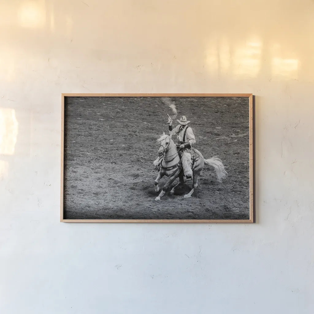 Rodeo I BW by Nathan Larson. shown as a paper print in a natural frame. Available as a archival giclee rolled canvas, fine art paper, or poster print. SKU 82721i.
