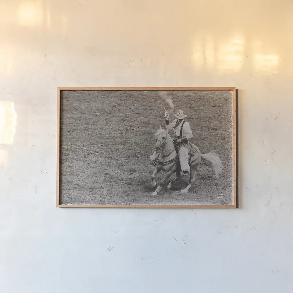Rodeo I Sepia by Nathan Larson. shown as a paper print in a natural frame. Available as a archival giclee rolled canvas, fine art paper, or poster print. SKU 82723i.