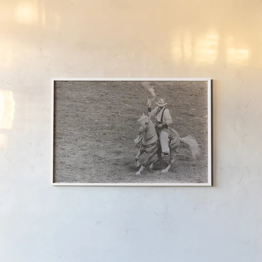 Rodeo I Sepia by Nathan Larson. shown as a paper print in a white frame. Available as a archival giclee rolled canvas, fine art paper, or poster print. SKU 82723i.