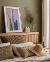 Saguaro Purple Pastel by Nathan Larson. shown as a paper print in a natural frame. Available as a archival giclee rolled canvas, fine art paper, or poster print. SKU 97578h.