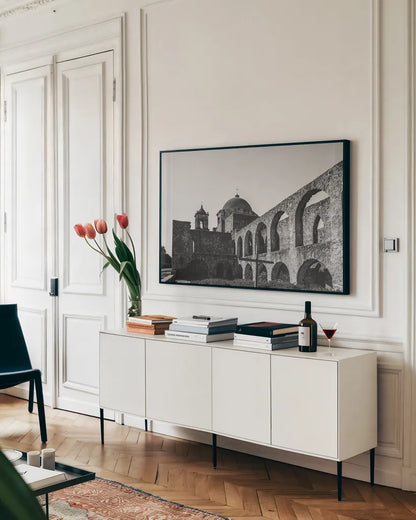 San Antonio Mission I by Nathan Larson. shown as a framed stretched canvas in a living room above a console. Available as a archival giclee rolled canvas, fine art paper, or poster print. SKU 102780i.