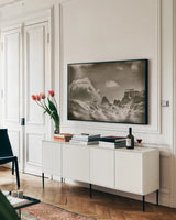 Sepia Peaks by Nathan Larson. shown as a framed stretched canvas in a living room above a console. Available as a archival giclee rolled canvas, fine art paper, or poster print. SKU 81191i.