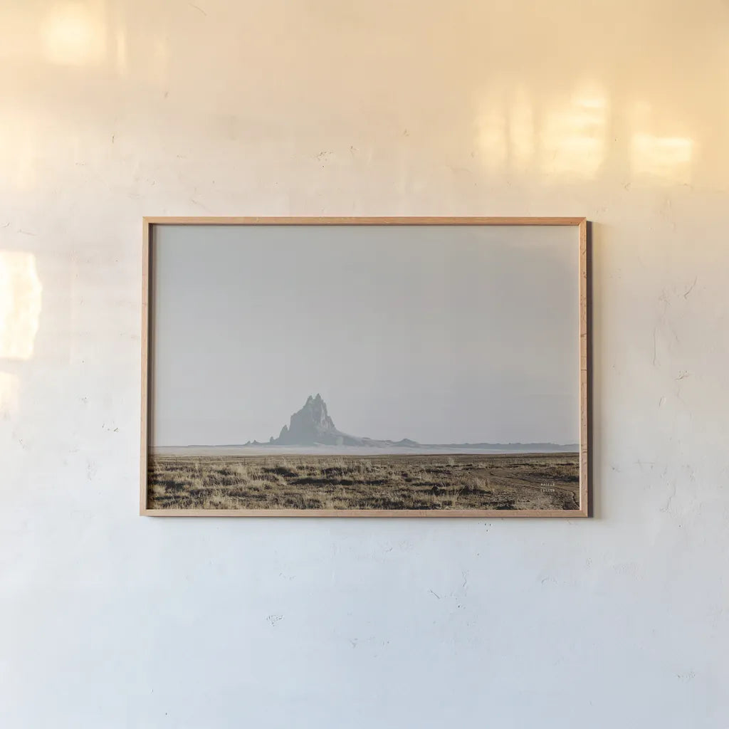 Shiprock Fade by Nathan Larson. shown as a paper print in a natural frame. Available as a archival giclee rolled canvas, fine art paper, or poster print. SKU 95336i.