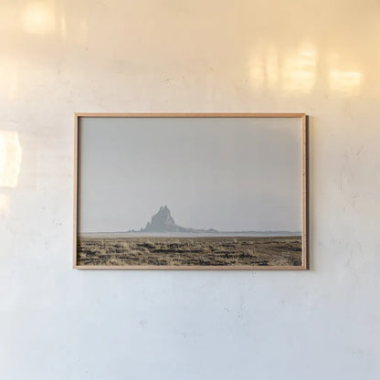 Shiprock Fade by Nathan Larson. shown as a paper print in a natural frame. Available as a archival giclee rolled canvas, fine art paper, or poster print. SKU 95336i.
