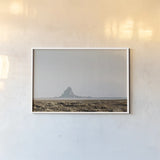 Shiprock Fade by Nathan Larson. shown as a paper print in a white frame. Available as a archival giclee rolled canvas, fine art paper, or poster print. SKU 95336i.