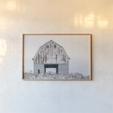 Sitting Still by Nathan Larson. shown as a paper print in a natural frame. Available as a archival giclee rolled canvas, fine art paper, or poster print. SKU 98508i.