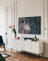 Snowy Range by Nathan Larson. shown as a framed stretched canvas in a living room above a console. Available as a archival giclee rolled canvas, fine art paper, or poster print. SKU 84267i.