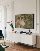 Snowy Range Antique by Nathan Larson. shown as a framed stretched canvas in a living room above a console. Available as a archival giclee rolled canvas, fine art paper, or poster print. SKU 84270i.