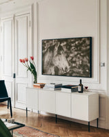 Snowy Range Sepia by Nathan Larson. shown as a framed stretched canvas in a living room above a console. Available as a archival giclee rolled canvas, fine art paper, or poster print. SKU 84269i.