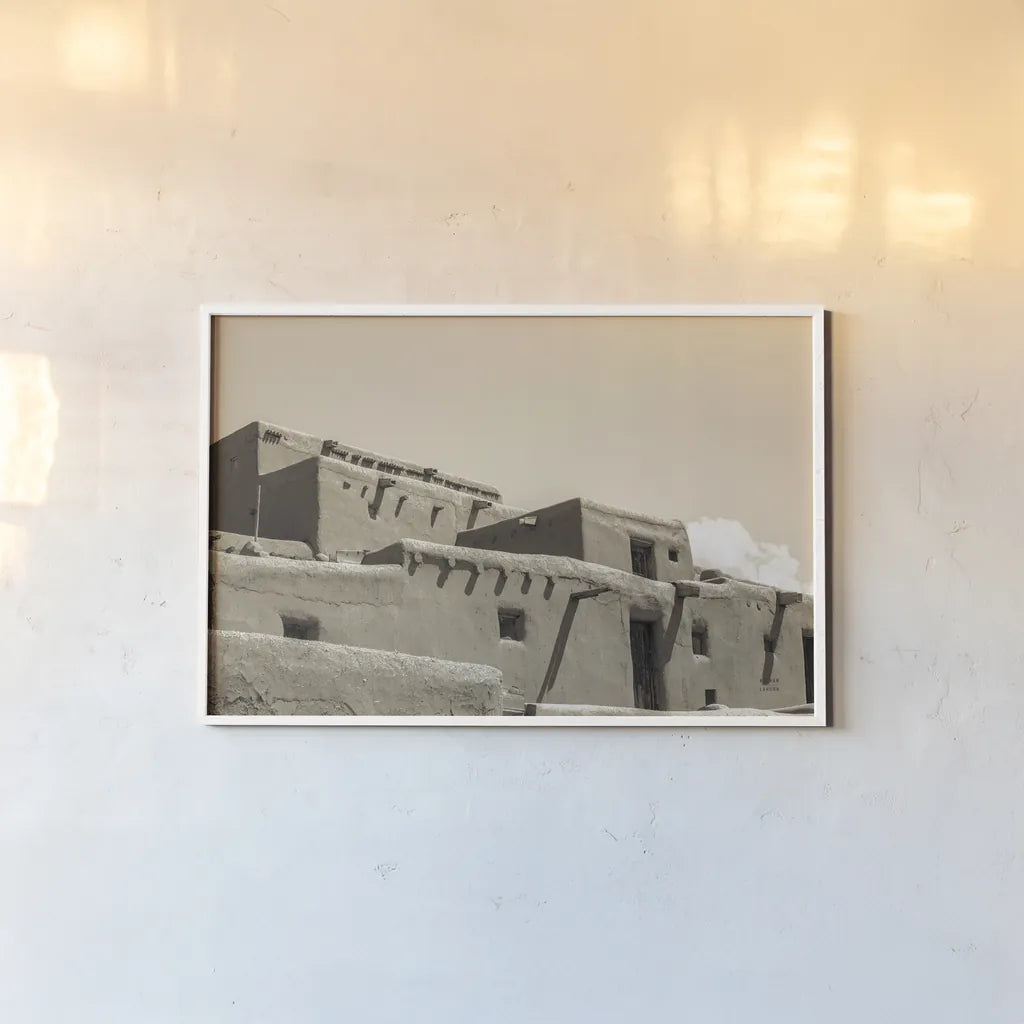 Southwest Adobe by Nathan Larson. shown as a paper print in a white frame. Available as a archival giclee rolled canvas, fine art paper, or poster print. SKU 77274i.