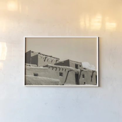 Southwest Adobe by Nathan Larson. shown as a paper print in a white frame. Available as a archival giclee rolled canvas, fine art paper, or poster print. SKU 77274i.