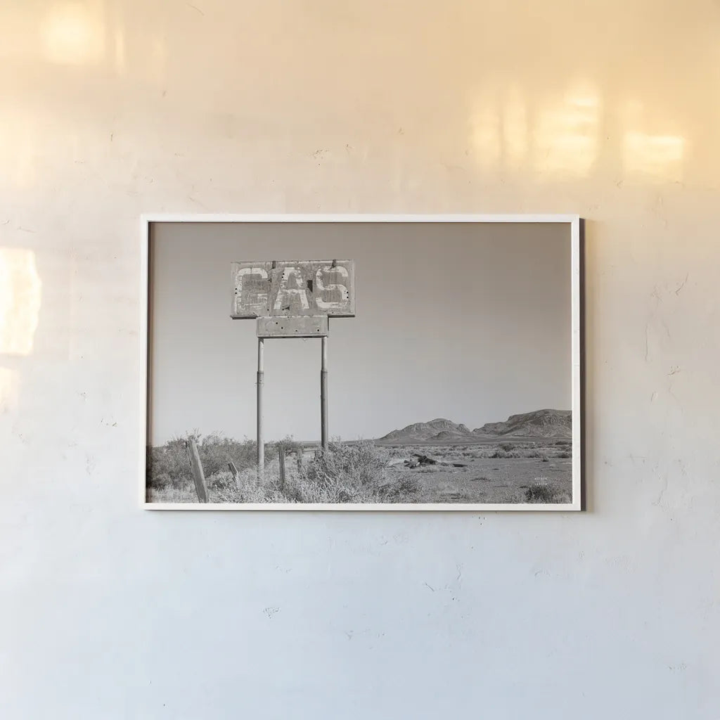 Southwest Gas Station by Nathan Larson. shown as a paper print in a white frame. Available as a archival giclee rolled canvas, fine art paper, or poster print. SKU 83391i.