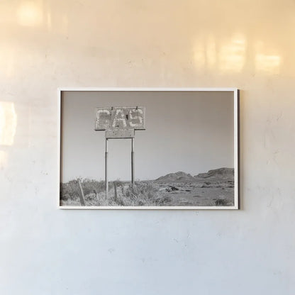 Southwest Gas Station by Nathan Larson. shown as a paper print in a white frame. Available as a archival giclee rolled canvas, fine art paper, or poster print. SKU 83391i.