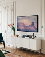 Southwest Sun by Nathan Larson. shown as a framed stretched canvas in a living room above a console. Available as a archival giclee rolled canvas, fine art paper, or poster print. SKU 80632i.