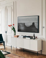 Southwest Sun BW by Nathan Larson. shown as a framed stretched canvas in a living room above a console. Available as a archival giclee rolled canvas, fine art paper, or poster print. SKU 80633i.