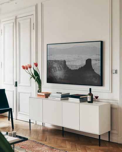 Southwest Sun BW by Nathan Larson. shown as a framed stretched canvas in a living room above a console. Available as a archival giclee rolled canvas, fine art paper, or poster print. SKU 80633i.