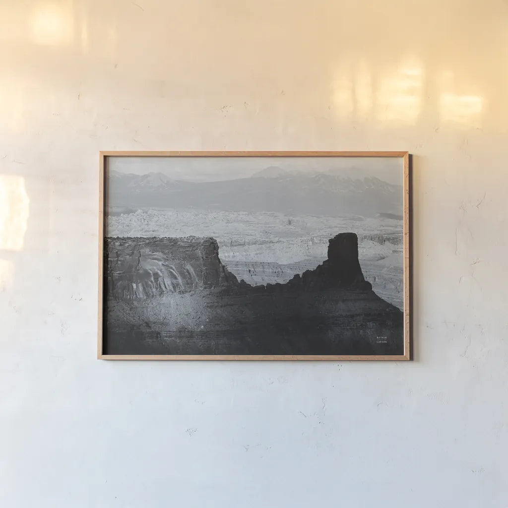 Southwest Sun BW by Nathan Larson. shown as a paper print in a natural frame. Available as a archival giclee rolled canvas, fine art paper, or poster print. SKU 80633i.