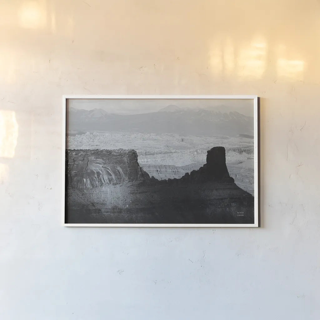 Southwest Sun BW by Nathan Larson. shown as a paper print in a white frame. Available as a archival giclee rolled canvas, fine art paper, or poster print. SKU 80633i.