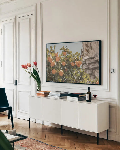 Spanish Islands Oranges by Nathan Larson. shown as a framed stretched canvas in a living room above a console. Available as a archival giclee rolled canvas, fine art paper, or poster print. SKU 85804i.