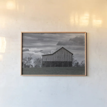 Spring Storms by Nathan Larson. shown as a paper print in a natural frame. Available as a archival giclee rolled canvas, fine art paper, or poster print. SKU 98030i.