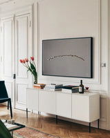 Springtime in the Air by Nathan Larson. shown as a framed stretched canvas in a living room above a console. Available as a archival giclee rolled canvas, fine art paper, or poster print. SKU 70272i.