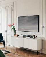 Storm Barn by Nathan Larson. shown as a framed stretched canvas in a living room above a console. Available as a archival giclee rolled canvas, fine art paper, or poster print. SKU 80684i.