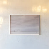 Storm Barn Bright by Nathan Larson. shown as a paper print in a white frame. Available as a archival giclee rolled canvas, fine art paper, or poster print. SKU 80685i.