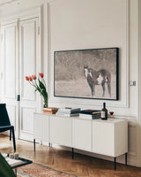 Sunny Field II by Nathan Larson. shown as a framed stretched canvas in a living room above a console. Available as a archival giclee rolled canvas, fine art paper, or poster print. SKU 97357i.