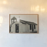Sunset Cross by Nathan Larson. shown as a paper print in a natural frame. Available as a archival giclee rolled canvas, fine art paper, or poster print. SKU 102619i.