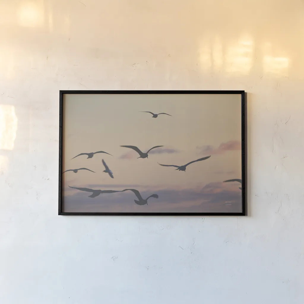 Sunset Flock by Nathan Larson. shown as a paper print in a black flame. Available as a archival giclee rolled canvas, fine art paper, or poster print. SKU 85269i.