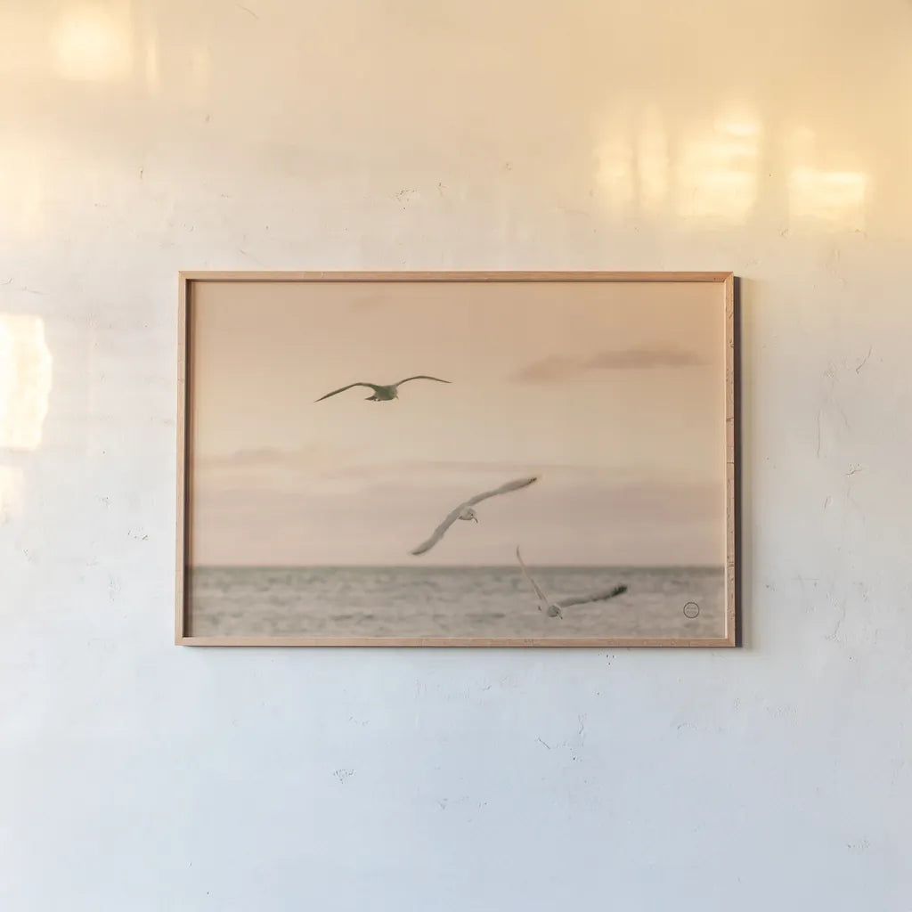 Sunset Flocks by Nathan Larson. shown as a paper print in a natural frame. Available as a archival giclee rolled canvas, fine art paper, or poster print. SKU 72056i.