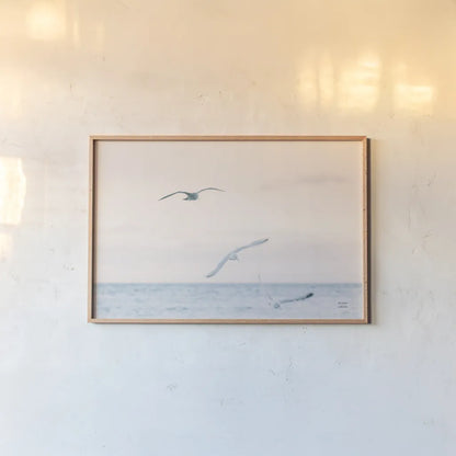 Sunset Flocks by Nathan Larson. shown as a paper print in a natural frame. Available as a archival giclee rolled canvas, fine art paper, or poster print. SKU 82386i.