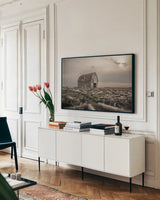 Sunset on Route 66 by Nathan Larson. shown as a framed stretched canvas in a living room above a console. Available as a archival giclee rolled canvas, fine art paper, or poster print. SKU 98506i.