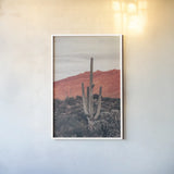 Sunsets and Saguaros I by Nathan Larson. shown as a paper print in a white frame. Available as a archival giclee rolled canvas, fine art paper, or poster print. SKU 76429h.