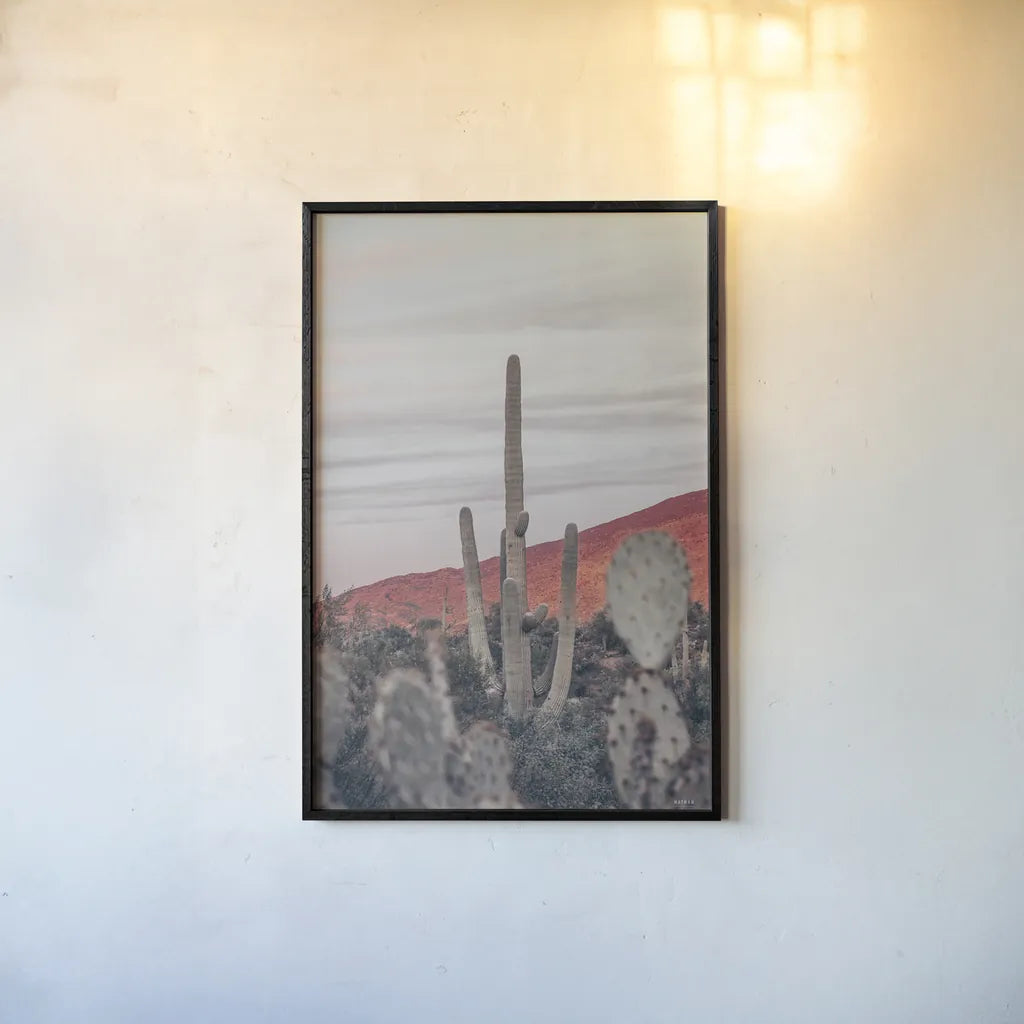 Sunsets and Saguaros II by Nathan Larson. shown as a paper print in a black flame. Available as a archival giclee rolled canvas, fine art paper, or poster print. SKU 76430h.