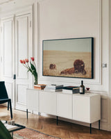 Tall Grass Bison by Nathan Larson. shown as a framed stretched canvas in a living room above a console. Available as a archival giclee rolled canvas, fine art paper, or poster print. SKU 87640i.