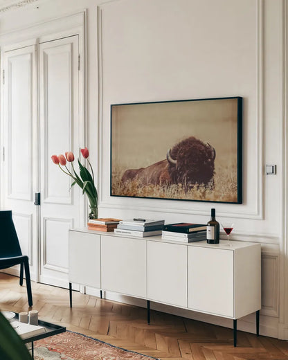 Tall Grass Bison II by Nathan Larson. shown as a framed stretched canvas in a living room above a console. Available as a archival giclee rolled canvas, fine art paper, or poster print. SKU 86066i.